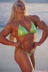Amazing Muscle Babe posing outdoors