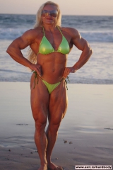 Amazing Muscle Babe posing outdoors