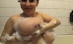 Horny chick is eager to show off her huge tits while shower