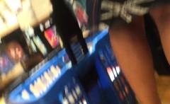 Hidden camera upskirt video of a woman walking in the books