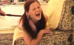 Petite redhead with pigtails bends over and relishes a hard spanking