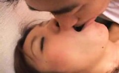 Attractive Japanese lady exchanges passionate kisses with a