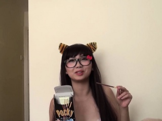 Asian teen gives a blowjob in tiger ears