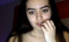 Cute teen perform striptease in front of webcam