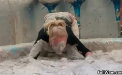 Sexy blonde gets covered in dirty mud