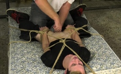 Restrained sub tormented with candle wax while ass fucked