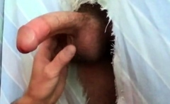 Filling the cocksucker's mouth at the homemade glory hole